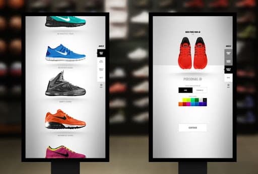 NIKEiD retail studio — two large portrait screens showing shoe catalog and color picker